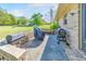Great outdoor patio with a built-in grill and bench, ready for entertaining in the backyard at 1955 Starr Sw Rd, Conyers, GA 30094