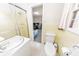 Bathroom featuring a toilet, vanity, tile, shower, and a window at 1955 Starr Sw Rd, Conyers, GA 30094