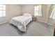 Bright bedroom with a large window, neutral walls, and plush carpet at 1955 Starr Sw Rd, Conyers, GA 30094