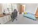 Cozy bedroom featuring a built-in desk, modern chair, and comfortable chaise lounge at 1955 Starr Sw Rd, Conyers, GA 30094