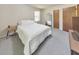 Cozy bedroom featuring a comfortable bed, neutral tones, and a mirror accent at 1955 Starr Sw Rd, Conyers, GA 30094