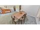 Modern dining set adjacent to a cozy living space enhances the home's functionality at 1955 Starr Sw Rd, Conyers, GA 30094