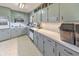 Kitchen with gray cabinets, subway tile, and a window that brings in natural light at 1955 Starr Sw Rd, Conyers, GA 30094