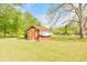 Backyard shed with a mounted surfboard, offering convenient storage and charm at 1955 Starr Sw Rd, Conyers, GA 30094