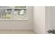This bright bedroom features a window and carpet at 300 Aspen Valley Dr, Loganville, GA 30052
