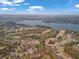 Aerial view showing the neighborhood's proximity to a large lake and golf course, offering stunning natural scenery at 8033 Louis Dr, Locust Grove, GA 30248