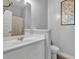 Well-lit bathroom featuring white cabinetry, modern fixtures, and neutral walls at 8033 Louis Dr, Locust Grove, GA 30248