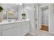 Bathroom featuring double vanity, white cabinets and trim, and tile floors at 8033 Louis Dr, Locust Grove, GA 30248