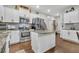 Modern kitchen with stainless steel appliances, granite countertops, and white cabinets at 8033 Louis Dr, Locust Grove, GA 30248