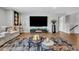 Beautiful living room featuring a big TV, cozy seating, and modern decor at 8033 Louis Dr, Locust Grove, GA 30248