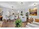 Bright living room with hardwood floors, decorative lighting, and stylish furniture at 8033 Louis Dr, Locust Grove, GA 30248