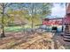 Large backyard featuring a deck, covered carport, and plenty of green space at 831 Sinyard Rd, Lithia Springs, GA 30122