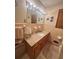 Cozy bathroom featuring a granite countertop, cabinet, and a well-lit mirror at 831 Sinyard Rd, Lithia Springs, GA 30122