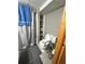 Small bathroom with a shower, toilet, and a built-in shelf at 831 Sinyard Rd, Lithia Springs, GA 30122