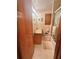 Modest bathroom featuring a granite countertop, cabinet, toilet, and tiled walls at 831 Sinyard Rd, Lithia Springs, GA 30122