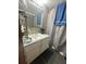 Small bathroom with a standing sink and a mirror at 831 Sinyard Rd, Lithia Springs, GA 30122