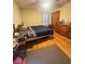 Bedroom with hardwood floors, a comfortable bed, dresser, and natural light from the window at 831 Sinyard Rd, Lithia Springs, GA 30122
