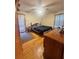 Bedroom with hardwood floors, a comfortable bed, dresser, and natural light from the window at 831 Sinyard Rd, Lithia Springs, GA 30122