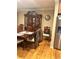 Traditional dining room with hardwood floors, china cabinet and modern stainless steel refrigerator at 831 Sinyard Rd, Lithia Springs, GA 30122