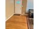 Inviting entryway with hardwood floors, white door with decorative window and a charming area rug at 831 Sinyard Rd, Lithia Springs, GA 30122