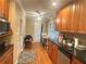 Kitchen featuring granite counters, stainless steel appliances, wood floors, and door leading outside at 831 Sinyard Rd, Lithia Springs, GA 30122