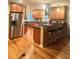 Spacious kitchen featuring wooden cabinets, stainless steel appliances, and a breakfast bar with seating at 831 Sinyard Rd, Lithia Springs, GA 30122