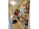 Functional pantry room featuring shelves, a window, and laundry appliances at 831 Sinyard Rd, Lithia Springs, GA 30122