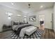 Stylish bedroom featuring a modern rug, and an open doorway to a brightly lit area at 1045 Mcdaniel St, Atlanta, GA 30310