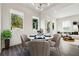 Eat-in dining area featuring modern light fixture, wood floors and large windows at 1045 Mcdaniel St, Atlanta, GA 30310