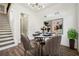 Dining room with wood floors, modern light fixture, and staircase at 1045 Mcdaniel St, Atlanta, GA 30310