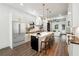 Bright kitchen with stainless steel refrigerator, large island, and barstool seating at 1045 Mcdaniel St, Atlanta, GA 30310