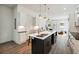 Modern kitchen with stainless steel appliances, kitchen island and barstool seating at 1045 Mcdaniel St, Atlanta, GA 30310