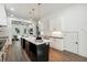 Open kitchen featuring a large island with seating, sleek countertops, and stylish lighting fixtures at 1045 Mcdaniel St, Atlanta, GA 30310