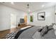 Bright main bedroom featuring wood floors, a ceiling fan, and a flat-screen television at 1045 Mcdaniel St, Atlanta, GA 30310