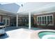 Backyard view featuring a patio, hammock, in ground pool, jacuzzi and manicured greenery at 84 Nw Gloster Nw Rd, Lawrenceville, GA 30044