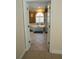 View of bathroom with large tub, neutral tile floors, and a window at 84 Nw Gloster Nw Rd, Lawrenceville, GA 30044