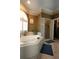 Bathroom featuring a corner tub, tiled surround, and separate shower at 84 Nw Gloster Nw Rd, Lawrenceville, GA 30044