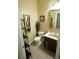 Charming powder room featuring unique vessel sink, framed mirrors, and tiled floor at 84 Nw Gloster Nw Rd, Lawrenceville, GA 30044