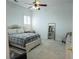 Bedroom with neutral carpet, gray plaid bedding, and a mirror at 84 Nw Gloster Nw Rd, Lawrenceville, GA 30044