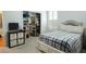Bedroom featuring an organized closet with shelves, hanging space, and a bed with a plaid blanket at 84 Nw Gloster Nw Rd, Lawrenceville, GA 30044