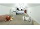 Bright bedroom featuring neutral paint, vaulted ceilings with fans and a comfortable couch in the foreground at 84 Nw Gloster Nw Rd, Lawrenceville, GA 30044