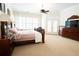 Spacious bedroom featuring large windows, carpeted floor, and natural light at 84 Nw Gloster Nw Rd, Lawrenceville, GA 30044