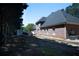 Brick home exterior, new roof, and well-maintained landscaping in a quiet, suburban setting at 84 Nw Gloster Nw Rd, Lawrenceville, GA 30044