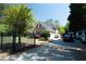 Beautiful brick home featuring an iron gate, well-maintained landscaping, and a spacious driveway at 84 Nw Gloster Nw Rd, Lawrenceville, GA 30044