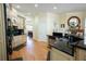 Open kitchen featuring wooden cabinets, granite countertops, stainless steel appliances, and hardwood floors at 84 Nw Gloster Nw Rd, Lawrenceville, GA 30044