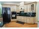 Kitchen featuring wooden cabinets, granite countertops, tile backsplash, and modern appliances at 84 Nw Gloster Nw Rd, Lawrenceville, GA 30044