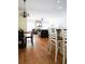 Spacious living room with hardwood floors, fireplace, and view of kitchen at 84 Nw Gloster Nw Rd, Lawrenceville, GA 30044