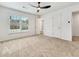 Spacious carpeted bedroom with ceiling fan, natural light and attached bath at 193 High Creek Dr, Roswell, GA 30076