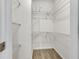 Walk-in closet featuring shelving and carpeting at 193 High Creek Dr, Roswell, GA 30076
