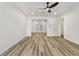 Bright and airy living room with wood floors and a ceiling fan for added comfort at 193 High Creek Dr, Roswell, GA 30076